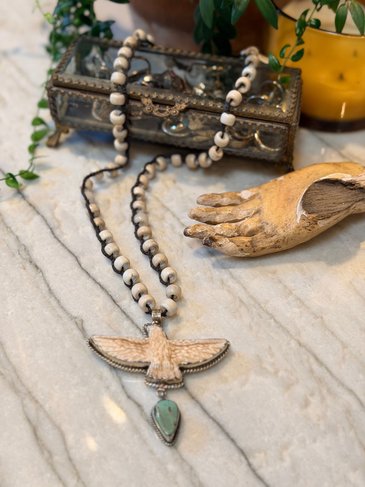 sterling silver plated
hand casted in bronze
hand casted
eagle necklace
chateau bel age
carved bone eagle