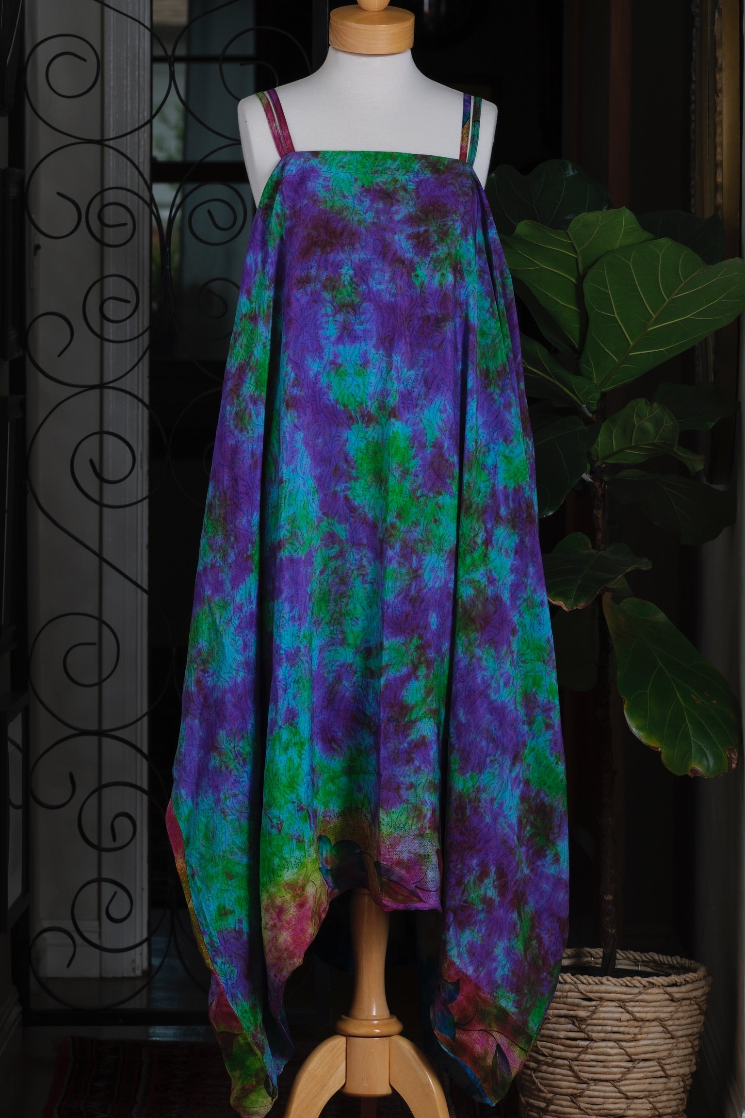 A sleeveless dress with a vibrant tie-dye pattern in purple, green, and blue, violet

tie dye

spaghetti straps

silk

shine

san diego style

san diego boutique

maxi

le bel age

green

Fashion

emerald

Dress

chateau bel age