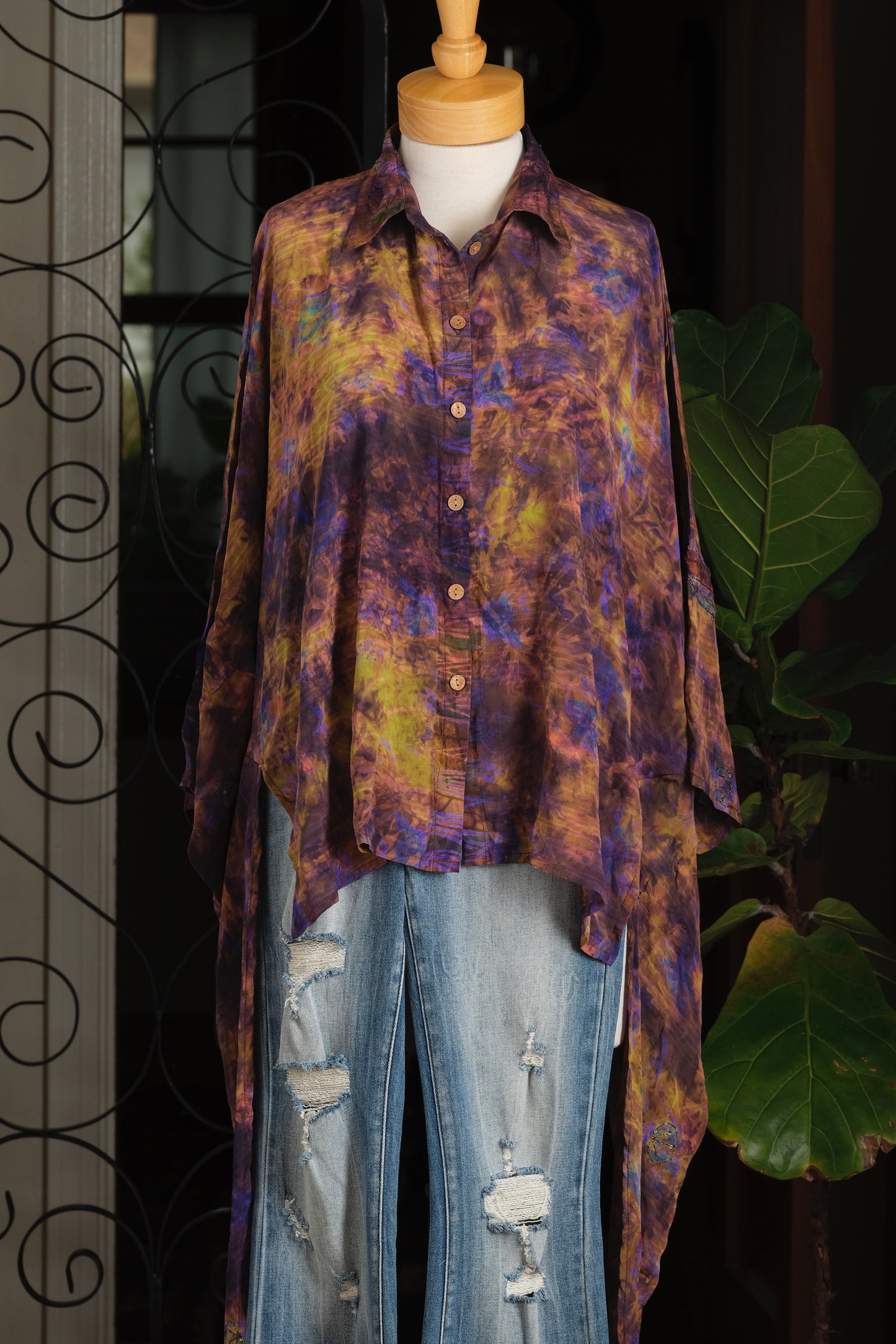 A long-sleeve button-up shirt with a purple, orange, and yellow tie-dye pattern, violet

tops

tie dye

shirt

royal blue

embellished

Dylan silk shirt

chateau bel age

Button Down

brown

blouse