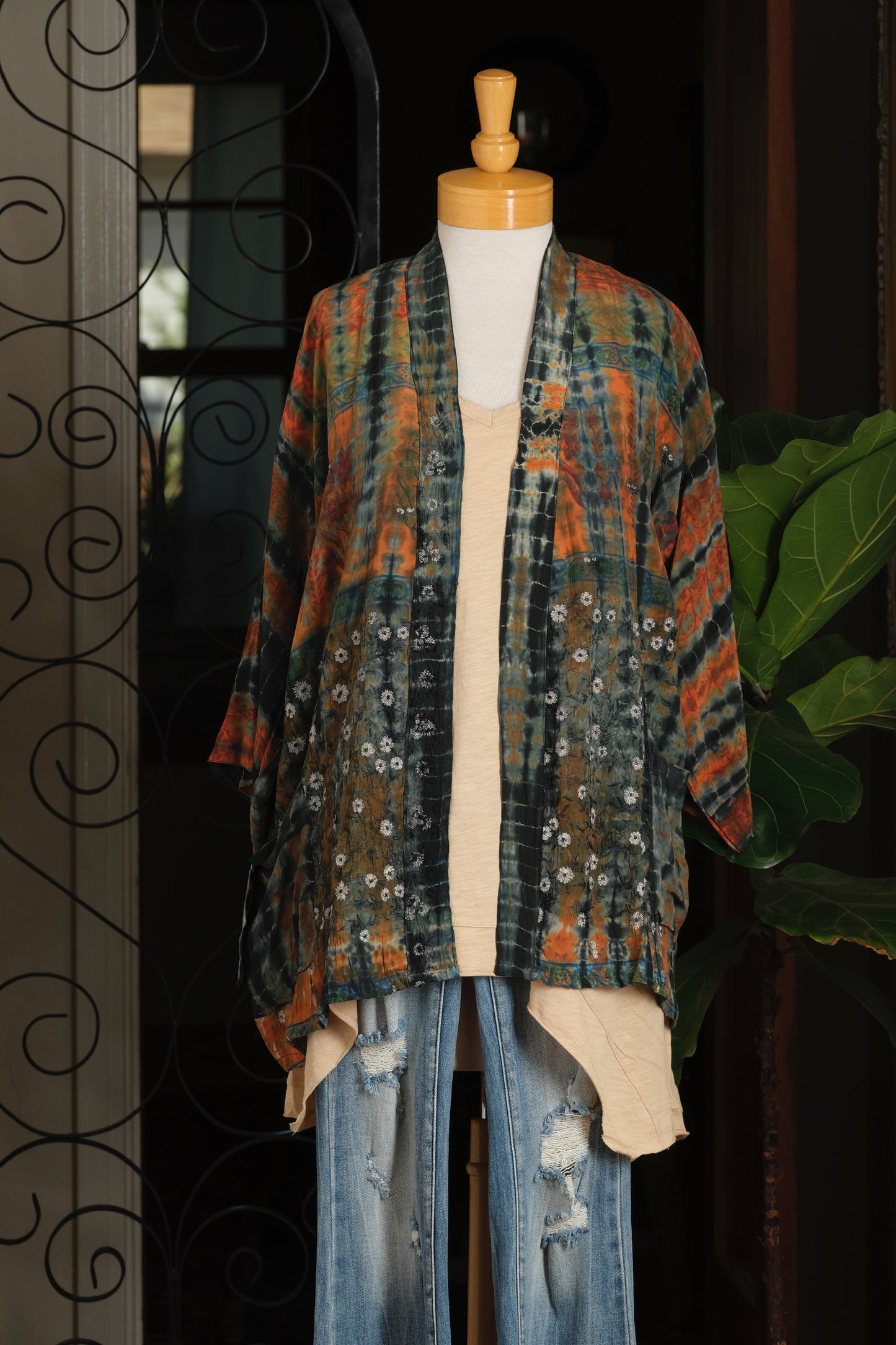 A multicolor tie-dye kimono cardigan with orange, green, and blue patterns, 
topper

tie dye

orange rust

mini duster

mini

layering piece

Embroidery

duster

chateau bel age

bohemian

blue

belage