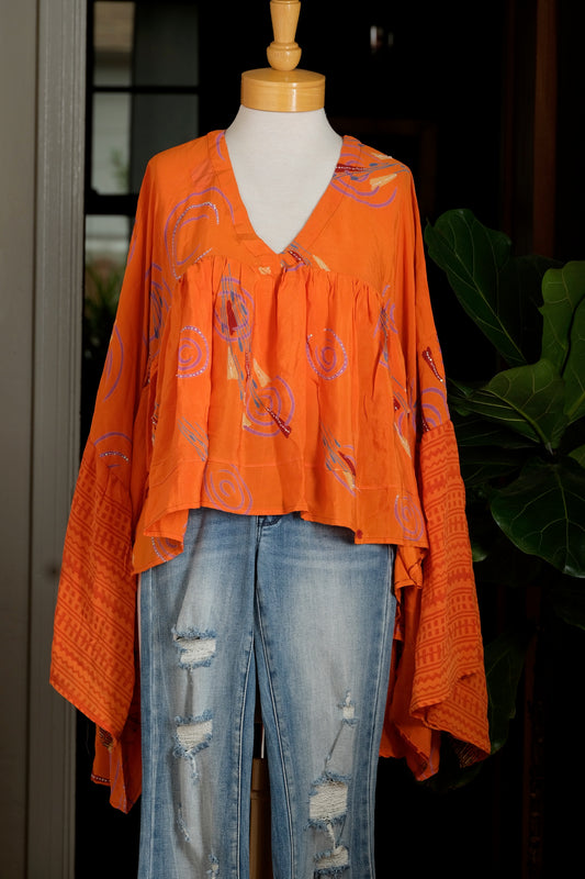 gold dust crop top

chateau bel age

silk

silk blouse

vneck
orange
vneck
upcycled silk
flowy top