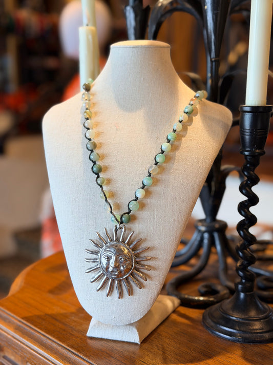 sun necklace
aqua stones
silver tone sun pendant

necklace

long bead necklace

chateau bel age