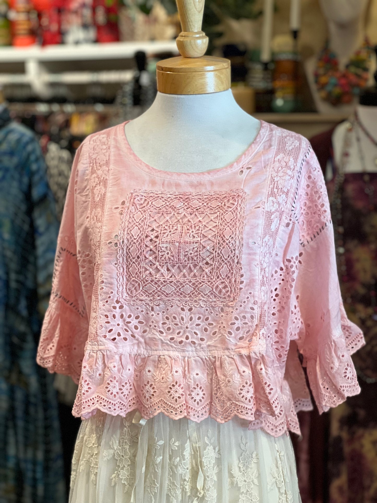 A light pink eyelet lace blouse with three-quarter ruffled sleeves and a scalloped hem.
top

softly worn top

one size

eyelet

Dear Heart Eyelet Top in Too Sweet

blouse