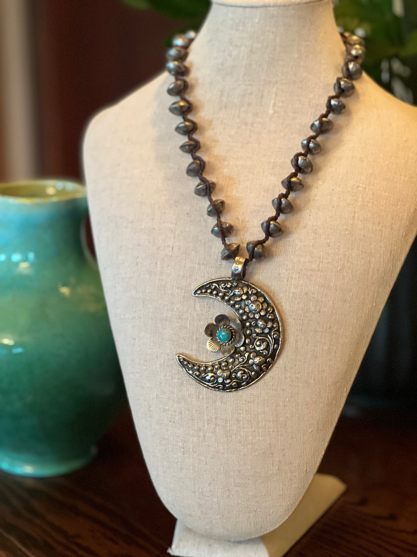 turquoise

necklaces

necklace

hollow silver beads

crescent necklace